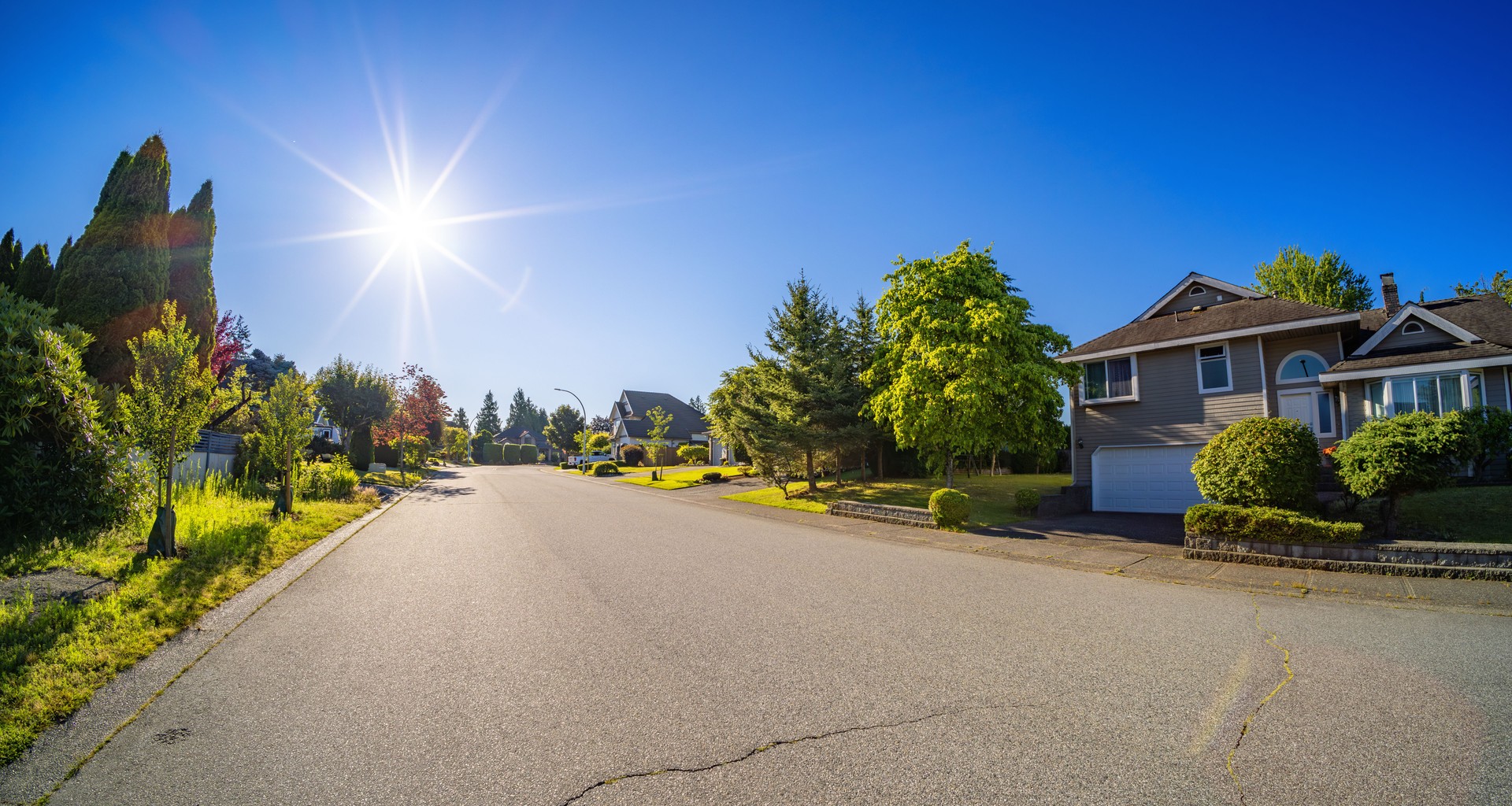 Residential Homes in a suburban city street sunny morning. Surrey, Vancouver, BC, Canada
